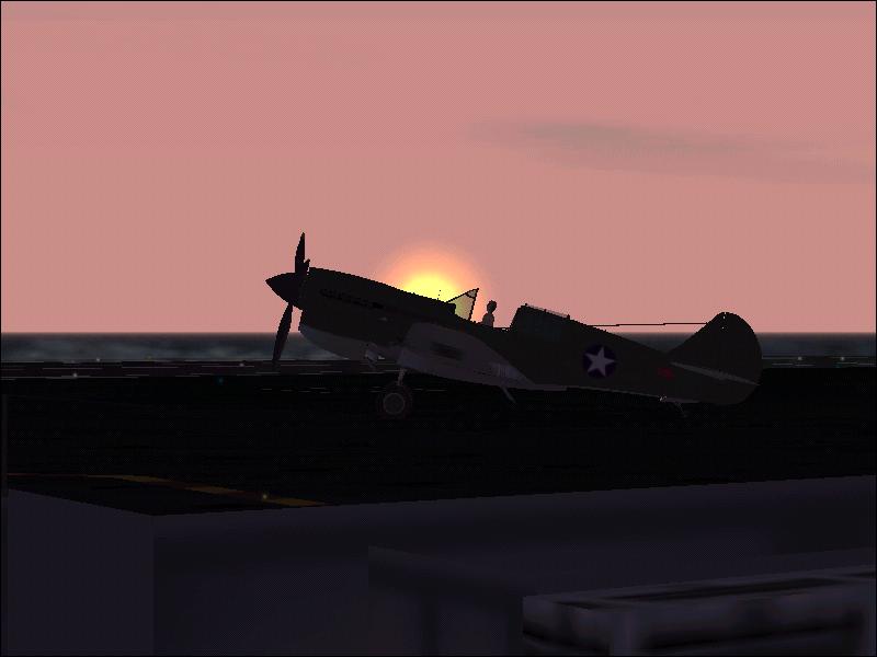AOS P-40 at dawn in carrier with engine sttoped and cannopy open - Photo 245