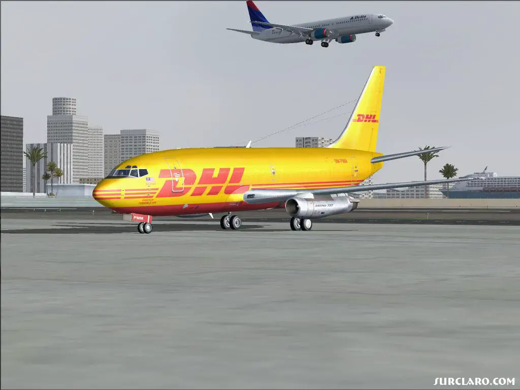 DHL 732 taxing to parking  at KSAN. Delta 738 landing in the background. - Photo 15591