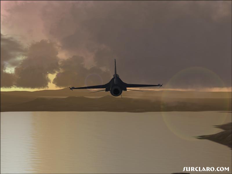 F-16 heading into the sunset.   - Photo 10952