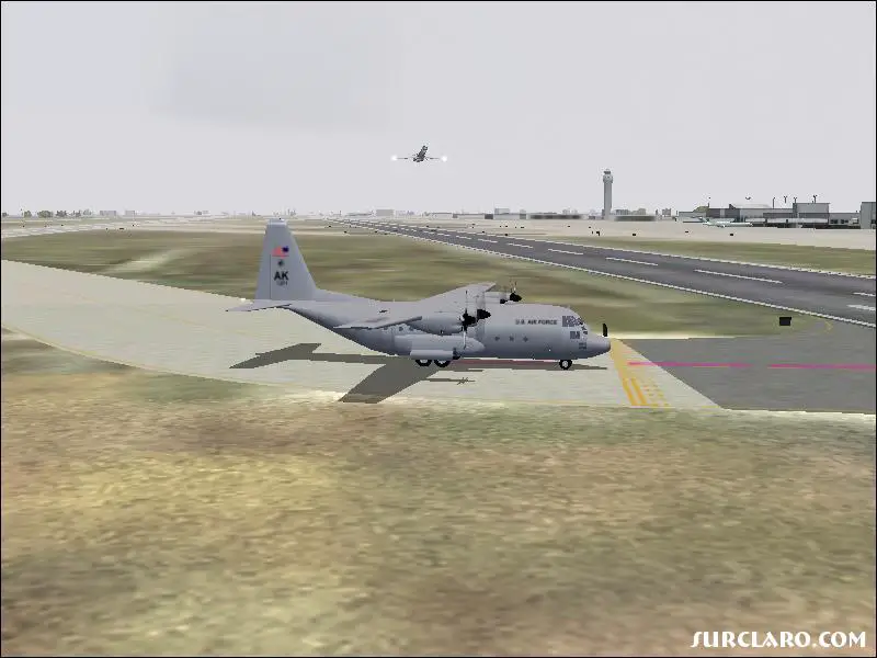 C-130 Hercules Holding at the runway for a departing MD-80 - Photo 15618