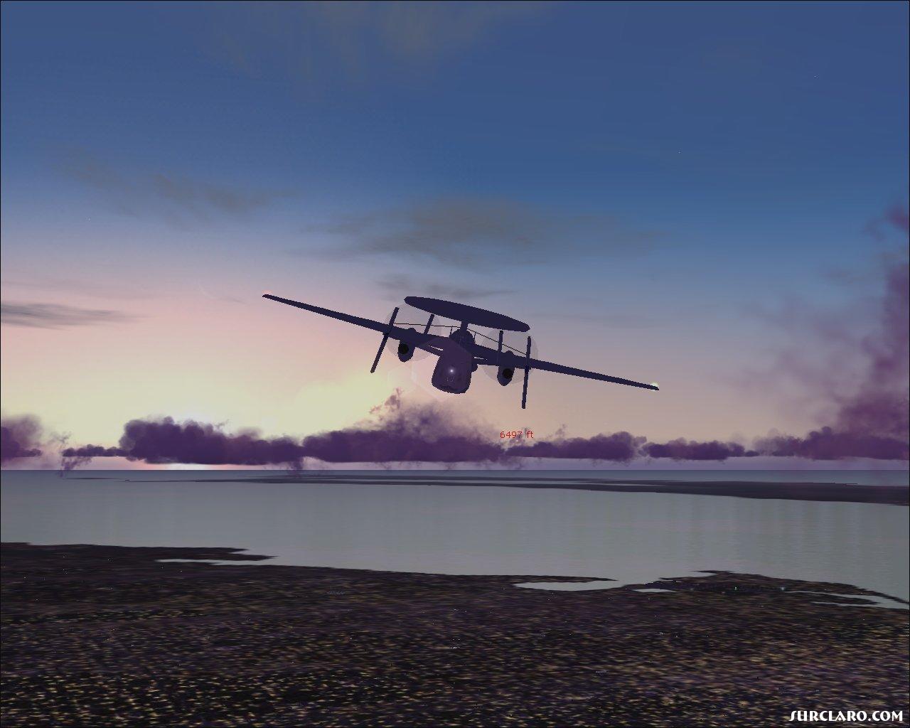 An E-2c Hawkeye flying into an early sunrise. - Photo 5613
