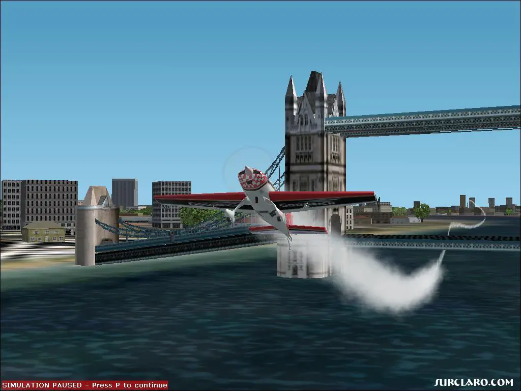 An Extra 300S flying underneath the Tower Bridge without hitting the water. - Photo 2739